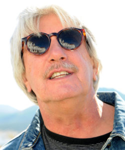  Author and journalist Christopher Leppek, with The Stanley Hotel reflected in his sunglasses. ©Shari Valenta